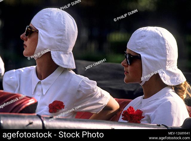 Hispano Suiza car rally - Santander to Madrid. two lady drivers of vintage Hispano Suiza cars. They wear white helmets and dark glasses