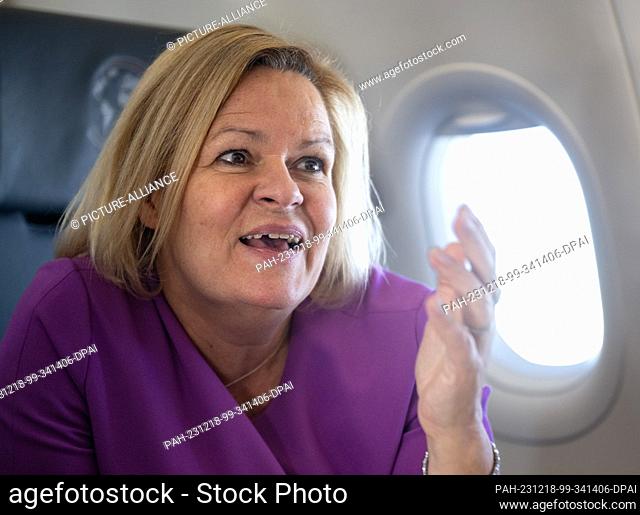 18 December 2023, Georgia, Tiflis: Federal Minister of the Interior Nancy Faeser (SPD) speaks in an Airbus A-321 of the German Air Force on the flight to...