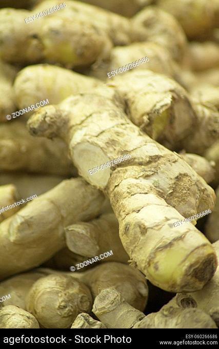 Ginger root on sale in supermarket grocers shop on display