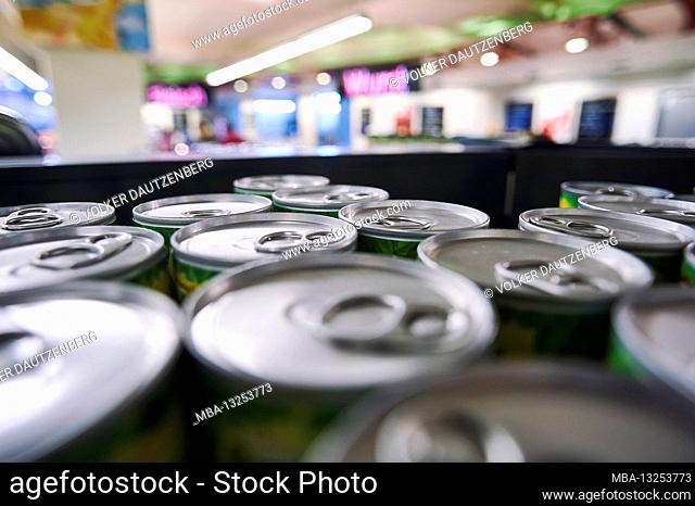 Perspective view of a supermarket over can lids on the supermarket shelf