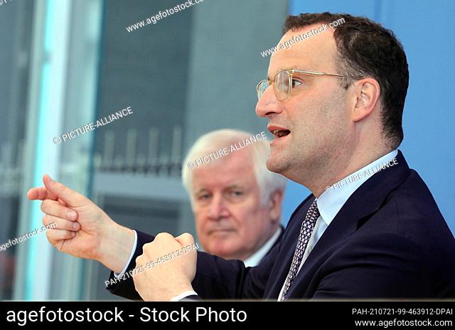 21 July 2021, Berlin: Jens Spahn (CDU, r) and Horst Seehofer (CSU), Federal Minister of the Interior, answer questions from journalists before the Federal Press...