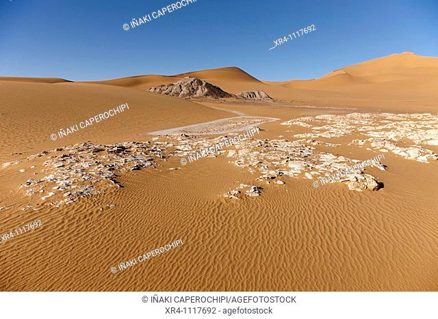 Salt concretions, dunes and Akakus massif near Ghat, Wadi Tanezzouft, Ghat, Libia