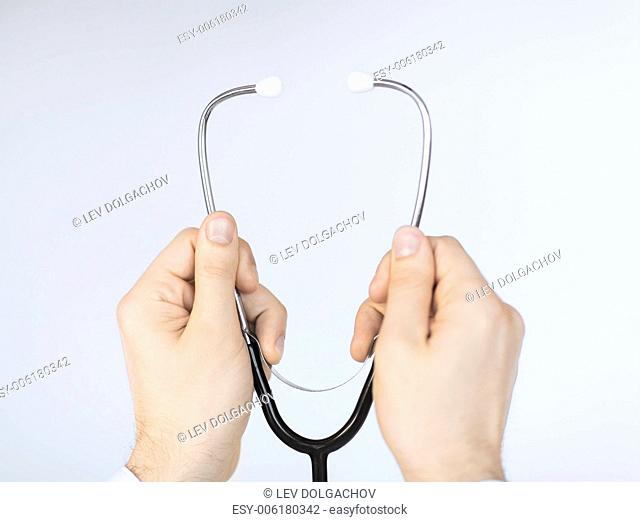 picture of doctor hands with stethoscope listening something