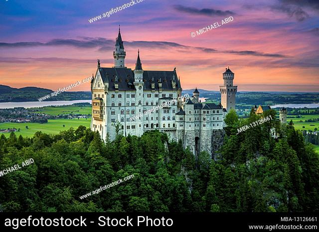Neuschwanstein castle in Bavaria, Germany at sunset