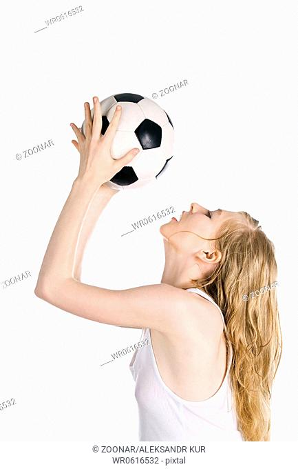 Bright picture of young blonde with soccer ball