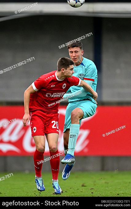 Gerard Vandeplas (20) of Antwerp fighting for the ball with Eman Kospo (3) of Barcelona during the Uefa Youth League matchday 6 game in group H in the 2023-2024...