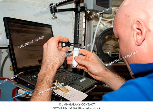 European Space Agency astronaut Luca Parmitano, Expedition 37 flight engineer, works with the Investigating the Structure of Paramagnetic Aggregates from...