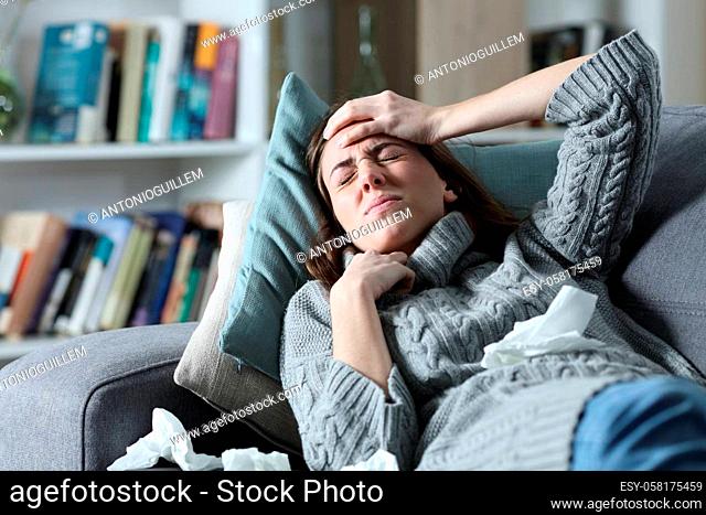 Ill woman suffering flu symptoms at home