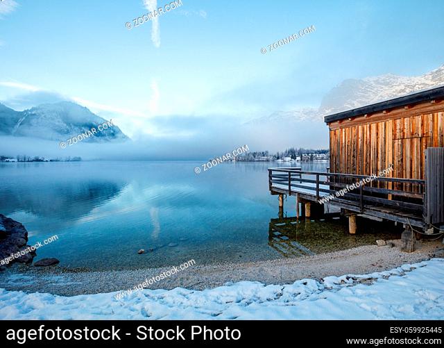 wooden pier at mountain Lake in winter at Grundlsee in Austria