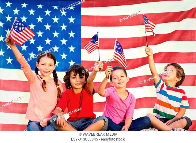 Composite image of children with american flags
