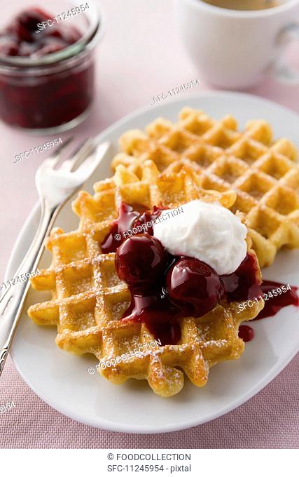 Waffles with cherries and cream