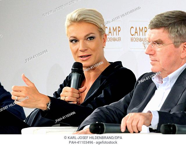 Alpine downhill skier Maria Hoefl-Riesch (L) and the vice president of the International Olympic Committee (IOC), Thomas Bach