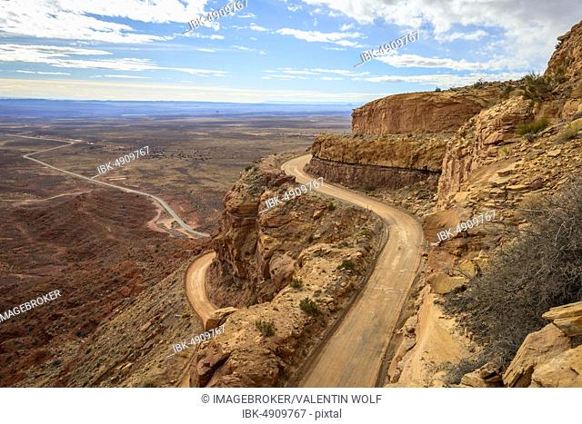 Moki Dugway leads in serpentines through the steep face of the Cedar Mesa, view of the Valley of the Gods, Bears Ears National Monument, Utah State Route 261