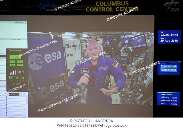 20 August 2018, Germany, Wessling: ESA astronaut Alexander Gerst can be seen on a monitor in the German Aerospace Center (DLR) at the Columbus Control Center...