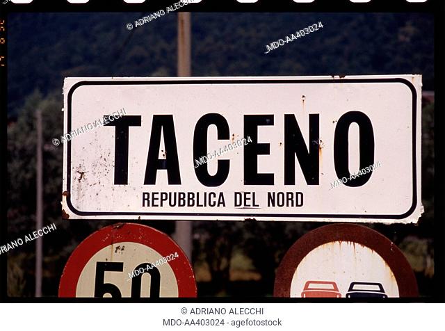 The road sign of the Taceno village with a Lega Nord sticker. A Lega Nord sticker stuck on the road sign of the Taceno village, in the Province of Lecco