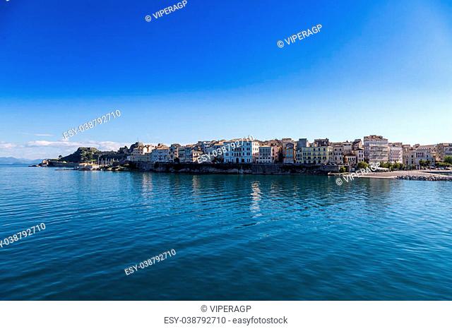 Corfu island cityscape from the sea with blue waters and sky