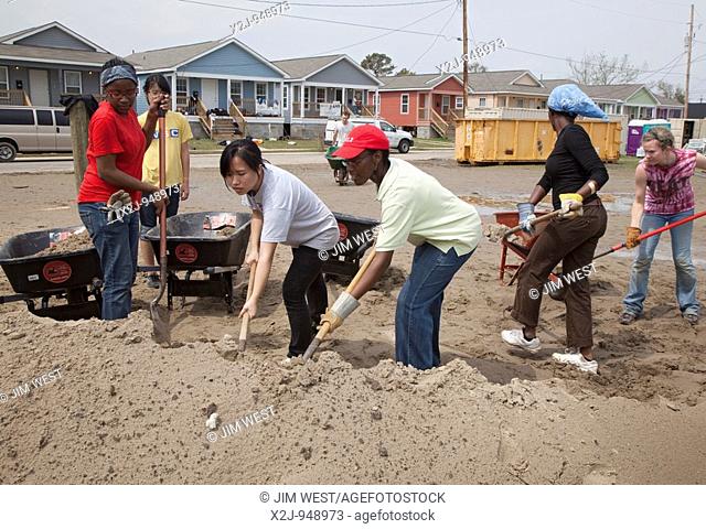 New Orleans, Louisiana - Student volunteers from Wellesley College/Brown University work on construction of new homes being built by Habitat for Humanity...