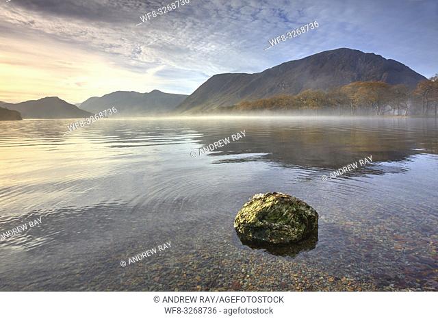 A boulder at the northern end of Crummock Water in the Lake District National Park, captured on a still misty morning in late October