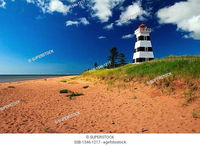Lighthouse on the coast, West Point lighthouse, Cedar Dunes Provincial Park, Northumberland Strait, Prince Edward Island, Canada