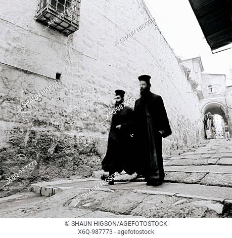greek orthodox monks stroll through the Old City Of Jerusalem in Israel in the Middle East