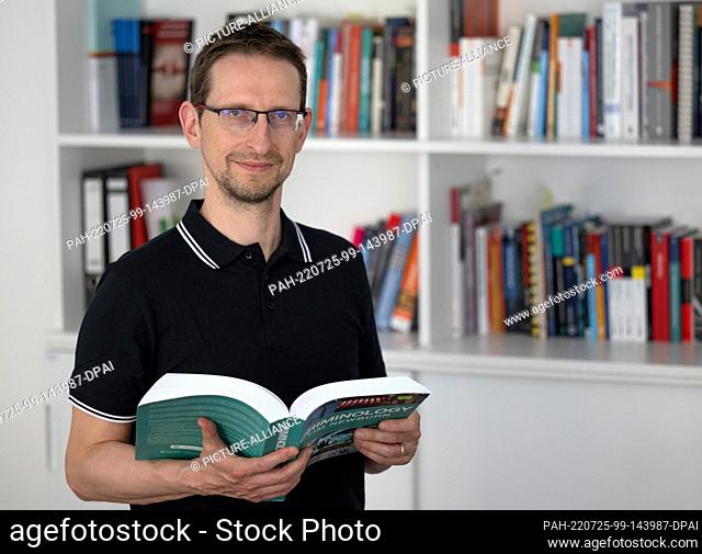 PRODUCTION - 21 July 2022, Saxony, Chemnitz: Frank Asbrock, director of the Center for Criminological Research Saxony (ZKFS) stands in the association's office...