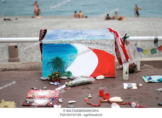 A painting of a beach painted in the French colours can be seen on the 'Promenade des Anglais' in Nice, France, 14 September 2016