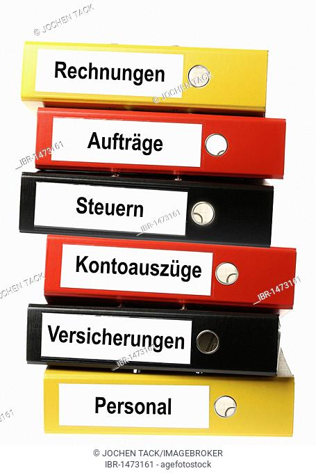 Black, yellow and red ring binders, labelled in German for invoices, contracts, taxes, bank statements, insurance and personal