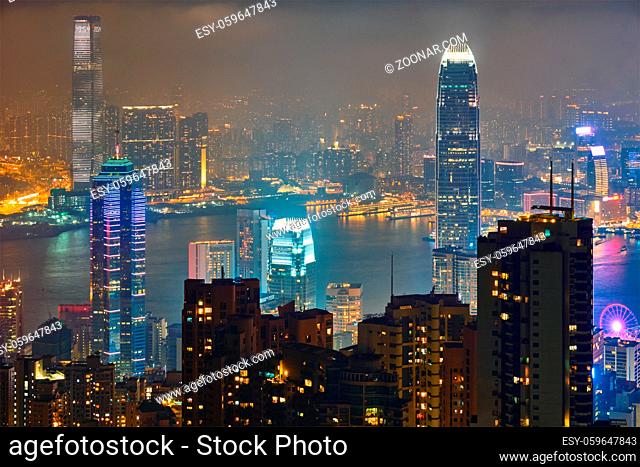 Famous view of Hong Kong - Hong Kong skyscrapers skyline cityscape view from Victoria Peak illuminated in the evening blue hour. Hong Kong, China
