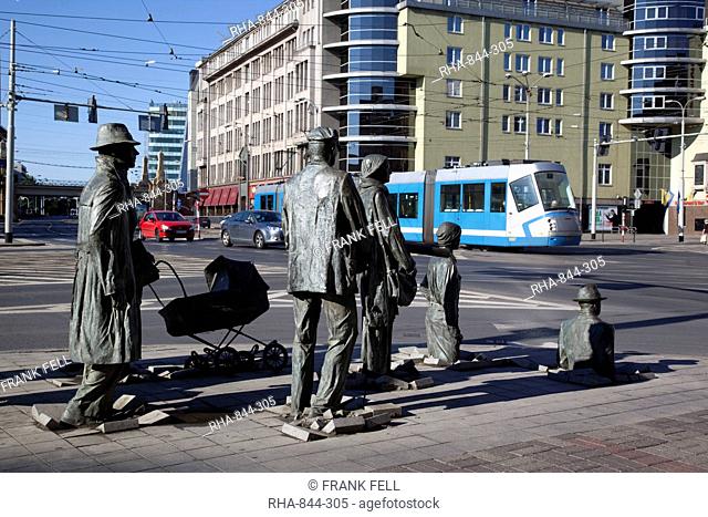 Memorial statues and tram, Old Town, Wroclaw, Silesia, Poland, Europe