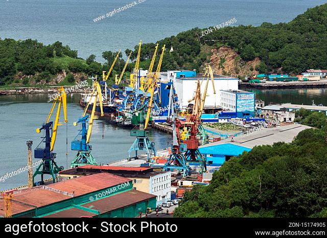 PETROPAVLOVSK-KAMCHATSKY, KAMCHATKA, RUSSIA - JULY 08, 2013: View on port cranes and cargo terminal on commercial seaport Petropavlovsk-Kamchatsky