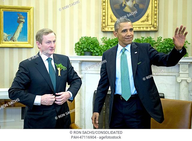 United States President Barack Obama, right, waves to the press pool as he completes his meeting Prime Minister Enda Kenny of Ireland in the Oval Office of the...