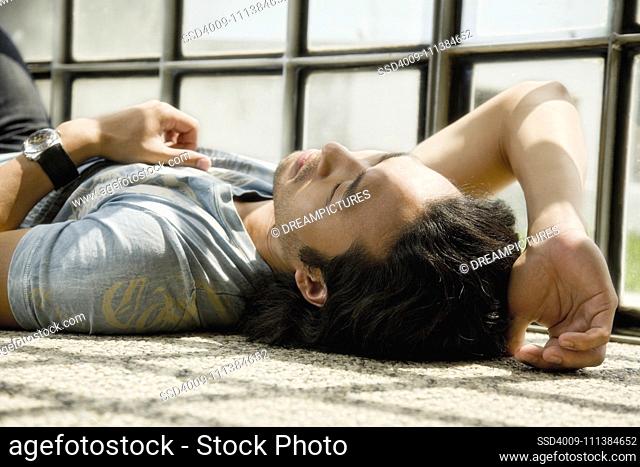 Korean man laying on floor