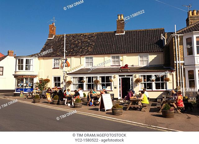 The Red Lion pub  Adnams  with people sitting outside in Southwold , Suffolk , England , Britain , Uk
