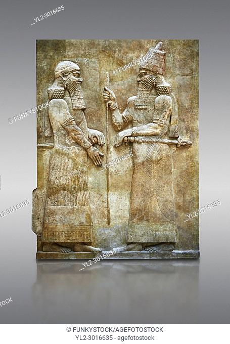 Stone relief sculptured panel of Saron II and a dignitary. Facade L. Inv AO 19873-4 from Dur Sharrukin the palace of Assyrian king Sargon II at Khorsabad