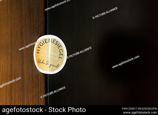 08 June 2022, Baden-Wuerttemberg, Donaueschingen: A hygiene seal is stuck on the door of a room in the ""Öschberghof"" hotel