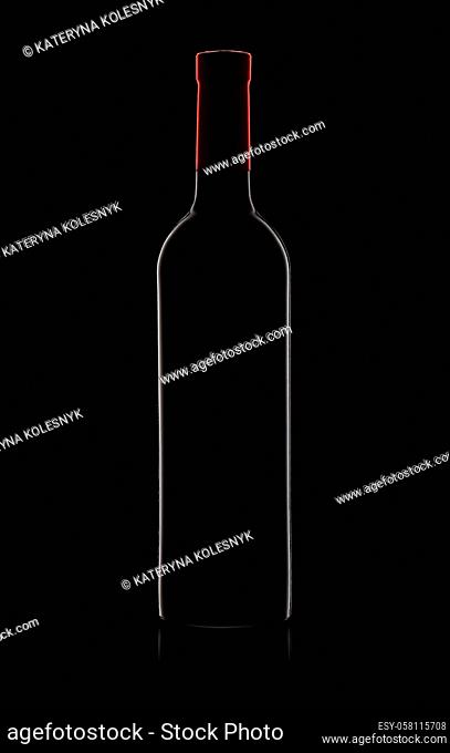 Silhouette of red wine bottle on black background