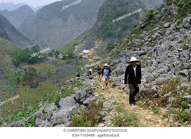 trekkers on mountain's path, around Sa Phin, Dong Van plateau, Ha Giang province, northern Vietnam, southeast asia
