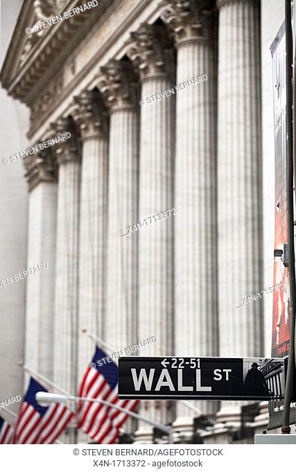 Wall Street sign in front of New York Stock Exchange in Manhattan, New York City, United States of America