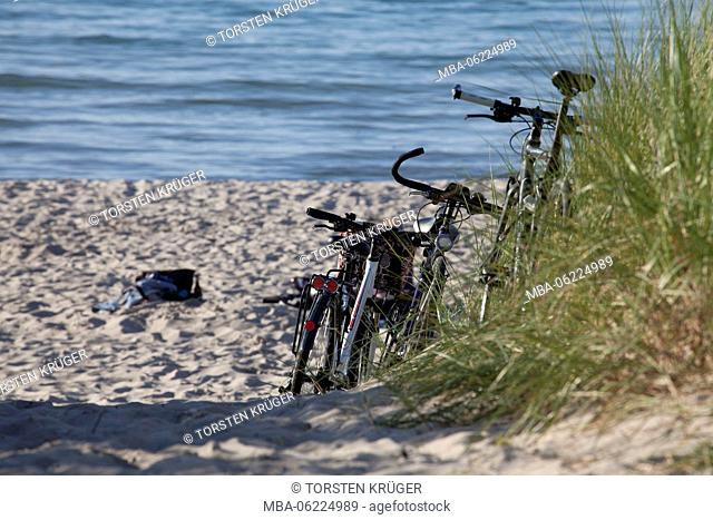 Rostock-Warnemünde, Parked bikes in the dunes on the beach