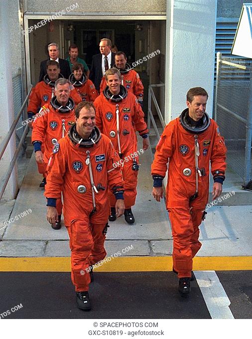 09/09/1997 --- STS-86 Commander James D. Wetherbee, in foreground at right, leads the way as the next Space Shuttle crew does a practice walkout from the...