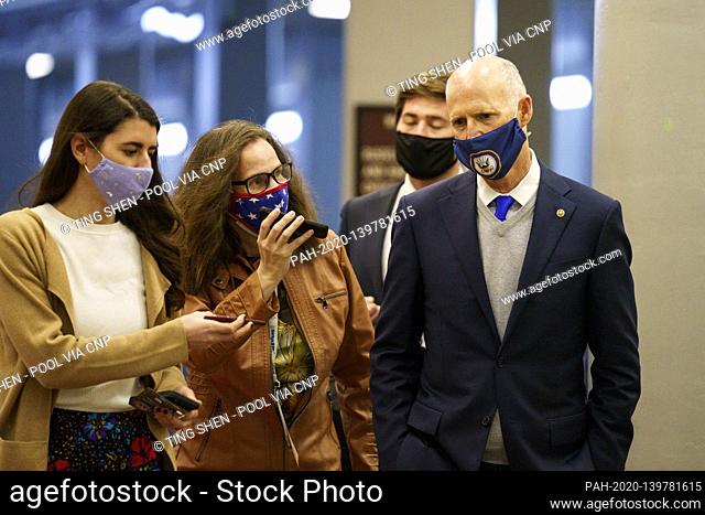 Senator Rick Scott, a Republican from Florida, wears a protective mask while walking through the Senate Subway at the U.S. Capitol in Washington, D.C