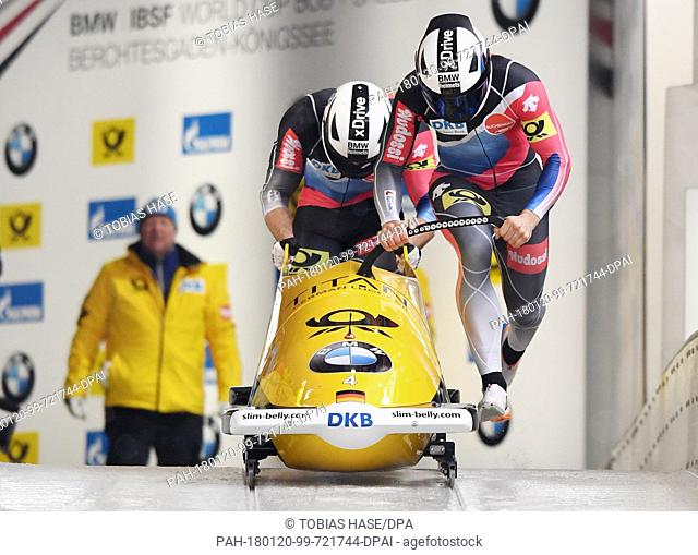 Germany's Johannes Locher and Christopher Weber launch into the race at the Bobsleigh World Cup men's doubles in Schoenau/Koenigssee, Germany, 20 January 2018