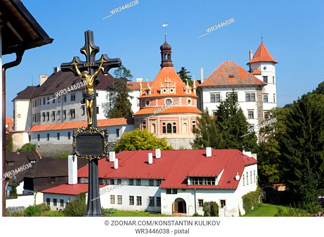 View from the hill with a crucifix (inscription in Czech- with Christ the world will be saved) on renaissance style castle, 16th century