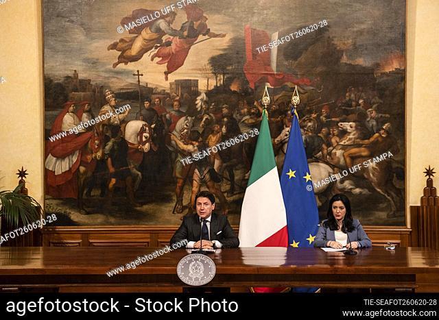 Italian Prime Minister Giuseppe Conte (L) and Education Minister Lucia Azzolina (R) hold a joint press conference at the Chigi Palace in Rome, Italy