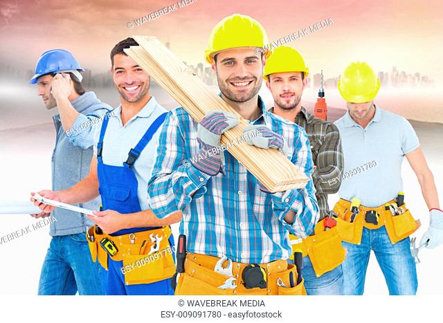 Composite image of construction worker carrying wooden planks