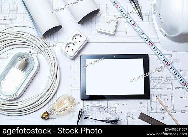 Construction drawing with tools and tablet with blank screen. top view