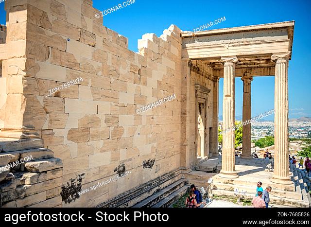 Athens, Greece - September 8, 2014: Tourists sightseeing the ruins of Erechtheion temple on Acropolis Hill, Athens Greece
