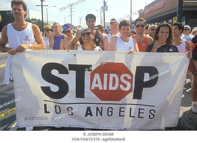 Protesters holding banner during AIDS rally, Los Angeles, California