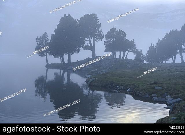 Camporrells hut and lakes at twilight, with mist in front of the Pic Peric(Pyrenees Orientales, France)