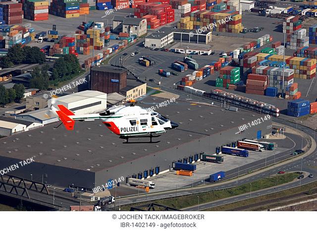 BK 117 police helicopter of the North Rhine-Westphalian police flying squadron during a mission flight, Ruhrort port, Duisburg, North Rhine-Westphalia, Germany